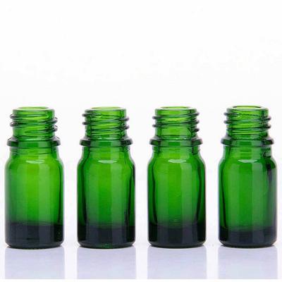 Bouteille d'huile essentielle de beauté en verre vert
