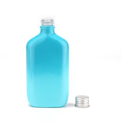Nouvelle bouteille en verre de couleur personnalisée avec pompe de pulvérisation pour cosmétique
