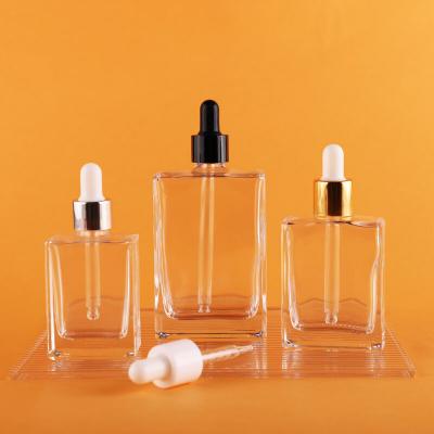 Emballage de bouteille de pulvérisation de compte-gouttes en verre de parfum carré de haute qualité