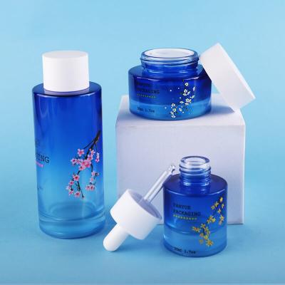 Emballage de jeu de bouteilles en verre à épaule plate bleu dégradé de haute qualité