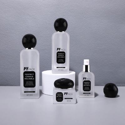 Spherical black cap round shoulder cosmetic bottle set