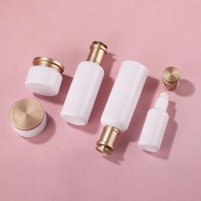 Golden Lid White Glass Bottle Set
